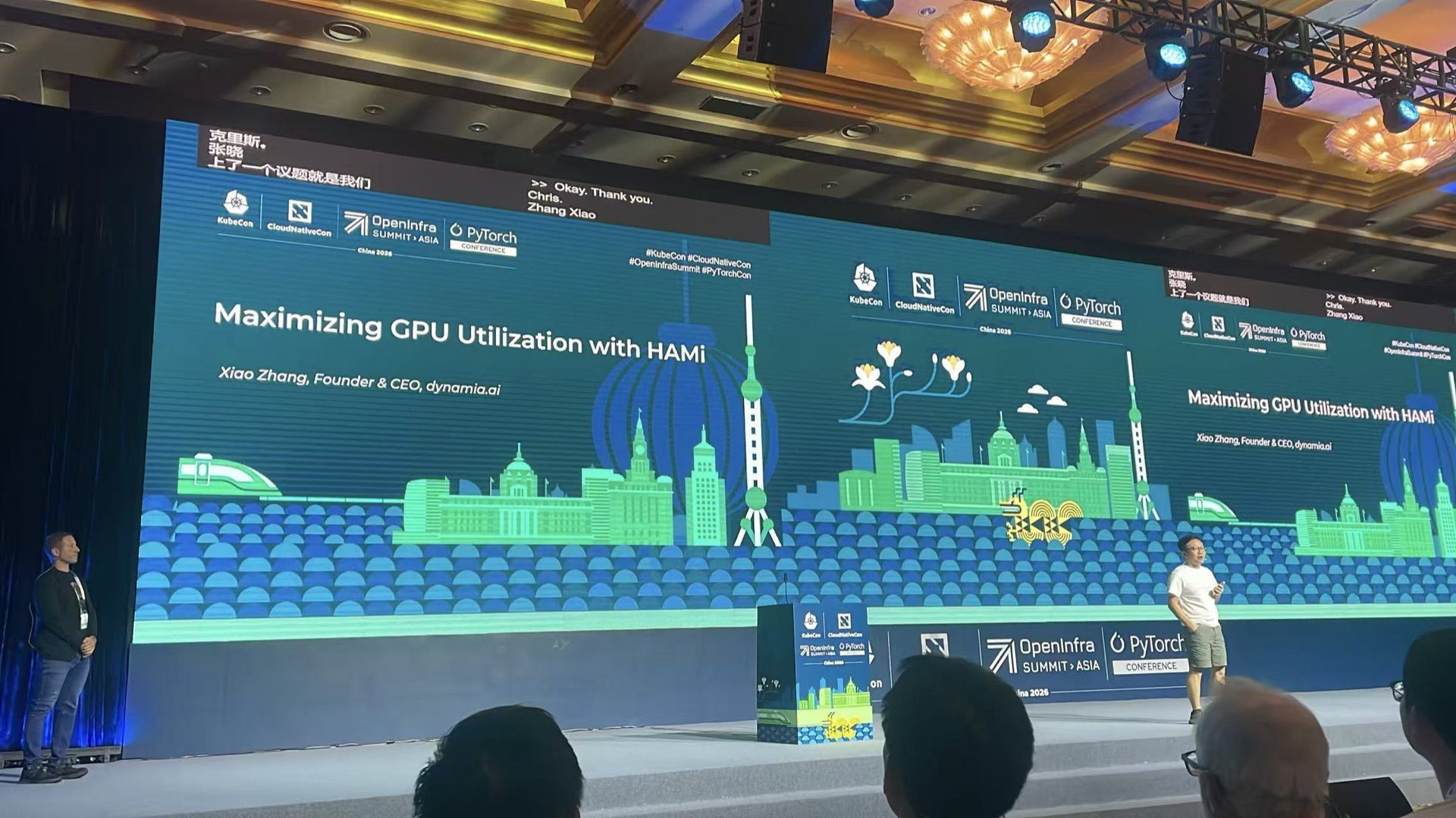 Xiao Zhang (Co-founder &amp; CEO, Dynamia) on the opening keynote stage, co-presenting with Chris Aniszczyk (CTO, Cloud and Infrastructure, The Linux Foundation)